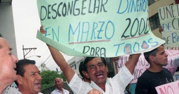 Ecuadoreans protest the neoliberal measures adopted by the government of Jamil Mahuad in order to save the banking industry in 1999.