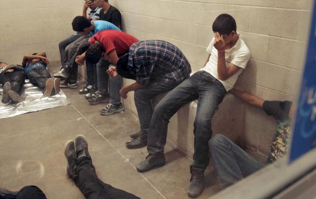 Immigrants housed inside the McAllen Border Patrol Station in McAllen, Texas, in this file photo taken July 15, 2014.