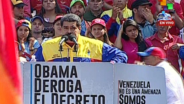 President Nicolas Maduro addresses tens of thousands of people during a mass rally in Caracas.