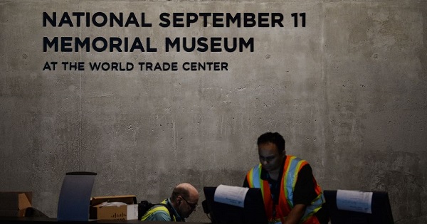 Workers prepare for the opening of the National September 11 Memorial Museum at the World Trade Center site.