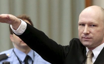 Terrorist Anders Behring Breivik raises his arm in a Nazi salute as he enters the court room in Skien prison, Norway, March 15, 2016. 