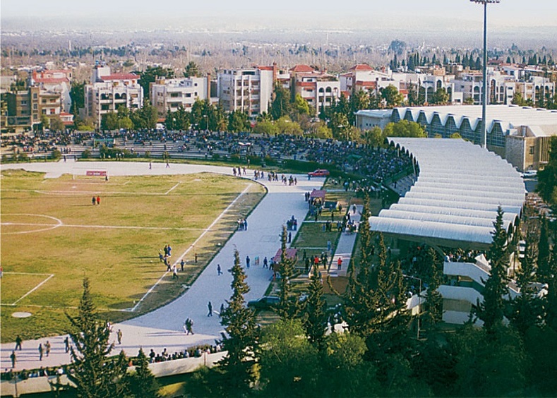Before: A view of Tishreen Stadium and neighborhood, Damascus.