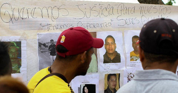 Relatives and friends of the 28 miners who went missing in the town of Tumeremo, Venezuela, demand answers from officials, March 8, 2016.