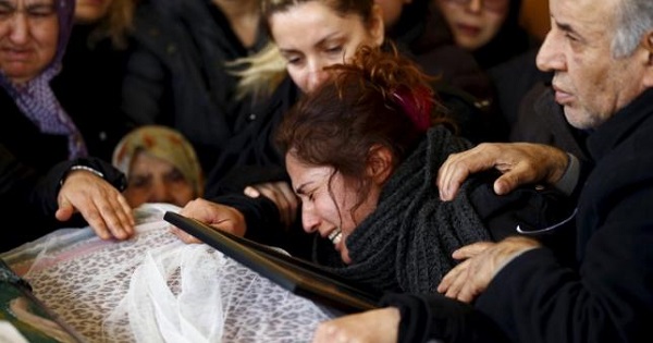 Asiye (L) mourns over her daughter's coffin during a funeral ceremony in Ankara, Turkey March 15, 2016.