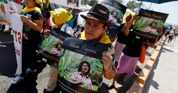 An Indigenous woman holds a poster with a photograph of Berta Caceres during a march to demand justice in Tegucigalpa, Honduras, March 16, 2016.