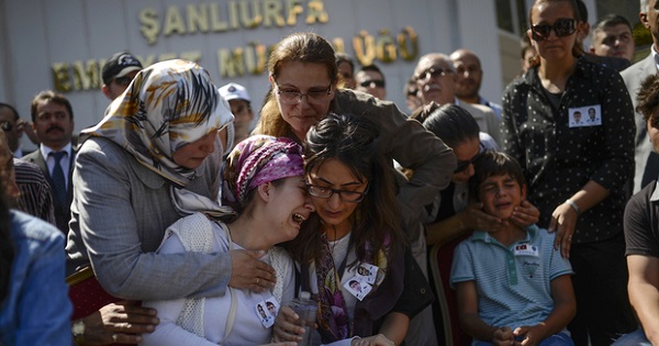 Relatives of one of two Turkish police officers killed in clashes with Kurdistan Workers' Party (PKK) militants, mourn during their funeral procession on 23 July 2015, in Sanliurfa.