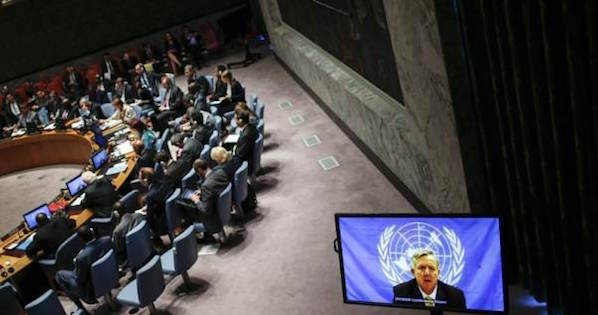 U.N. Ebola mission chief Anthony Banbury (on Screen) speaks to members of the United Nations Security Council during a meeting on the Ebola crisis at the U.N. headquarters in New York , Oct. 14, 2014.