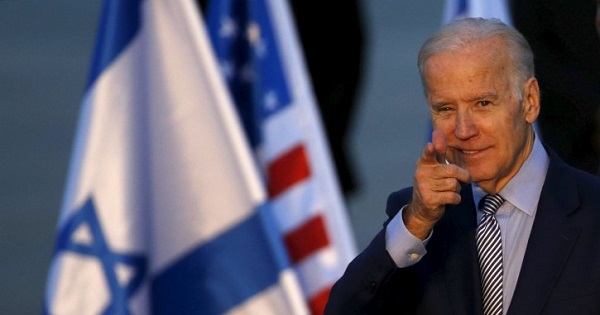 U.S. Vice President Joe Biden gestures after disembarking from a plane upon landing at Ben Gurion International Airport in Lod, near Tel Aviv, Israel March 8, 2016