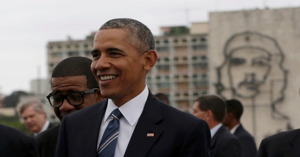 U.S. President Barack Obama stands near an image of late revolutionary hero Ernesto 