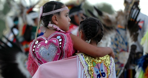 Young Native American dancers stand together during the Oglala Nation Pow Wow and Rodeo in Pine Ridge, South Dakota, Aug. 4, 2006.