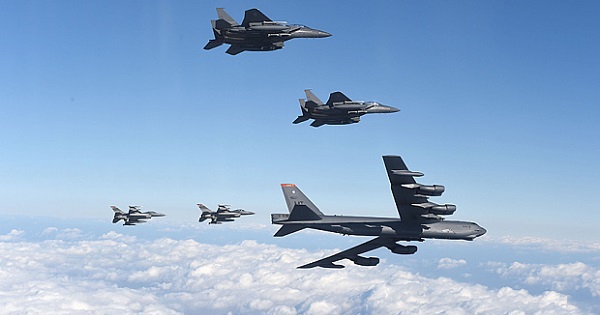A U.S. B-52 Stratofortress flying with South Korean F-15K fighter jets and US F-16 fighter jets over South Korea.