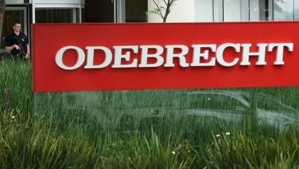 A police officer stands guard at the Odebrecht office in Sau Paulo on Feb. 22, 2016.