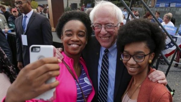 Bernie Sanders and two supporters outside the Columbia Democratic Party headquarters.