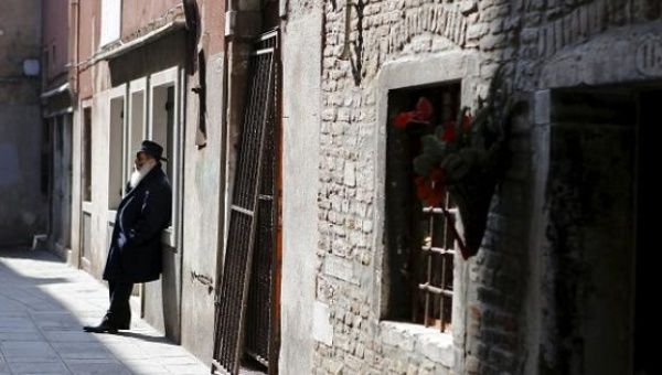 A Jewish man leans against a wall in the Venice ghetto, northern Italy, March 21, 2016.