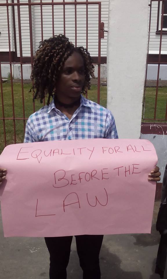 A member of Guyana's Transgender Community Protests outside the court in the county's capital, Georgetown.