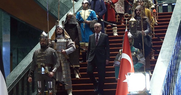 Turkish President Recep Tayyip Erdogan in front of the 16 actors dressed in the military costumes at the Turkish presidential palace in the capital Ankara.