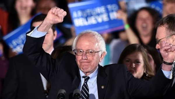 U.S. Democratic presidential candidate Bernie Sanders celebrates victory during a primary night rally.
