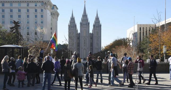 Members of The Church of Jesus Christ of Latter-day Saints and their supporters walk near the Salt Lake Temple after mailing their membership resignation to the church in Salt Lake City, Utah Nov. 14, 2015.