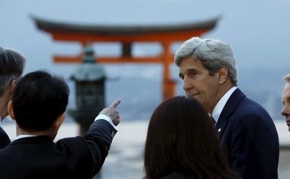U.S. Secretary of State John Kerry listens to Japanese Foreign Minister Fumio Kishida as they and G7 foreign ministers visit the Itsukushima Shrine in Japan, April 10, 2016. 