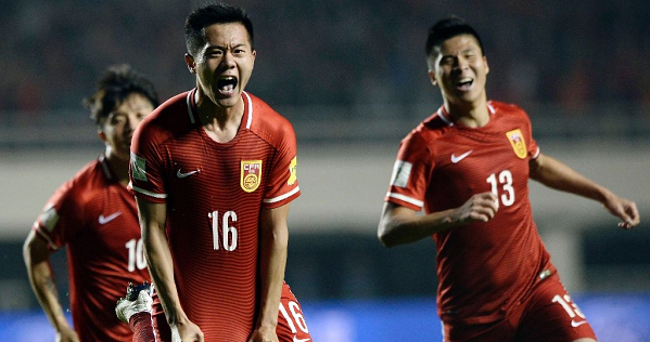 Chinese players celebrate their 2-0 victory over Qatar in a 2018 World Cup football qualifying match in Xi'an, Shanxi province