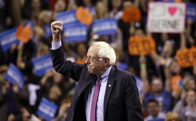 U.S. Democratic presidential candidate Bernie Sanders reacts during a rally.