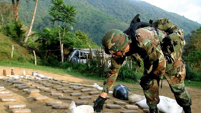 A soldier arranges packets of confiscated cocaine in Colombia's Valle del Cauca province in 2004 in part of the country's longstanding U.S.-backed war on drugs.