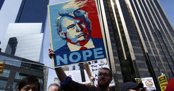 People rally as they take part in a protest against U.S. Republican presidential candidate Donald Trump in New York, March 19, 2016.