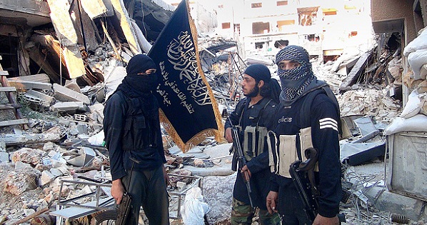 Fighters from the al-Qaida affiliated Nusra Front near the front line with Syrian government solders in Yarmuk