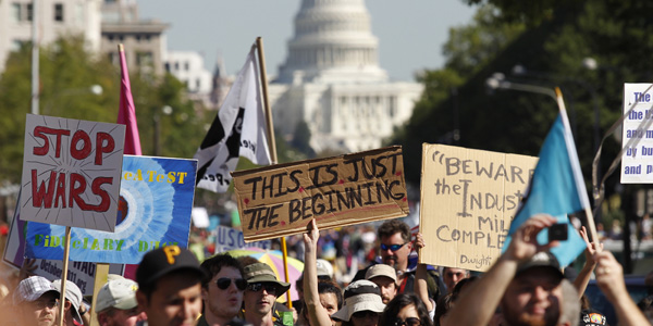 Protesters associated with the Occupy Wall Street movement march in Washington, DC, in October 2011.