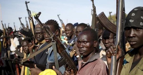 South Sudanese fighters hold their weapons.