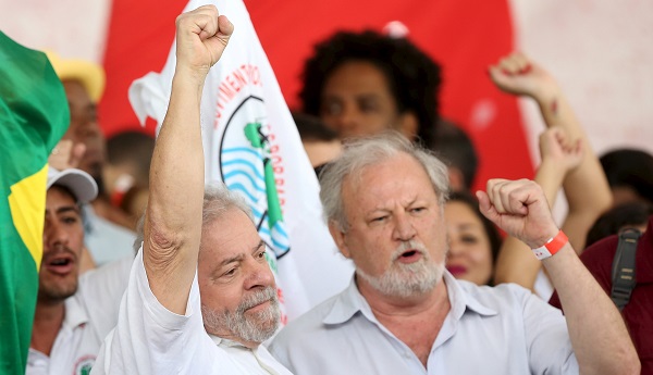 Brazil's former President Lula da Silva (L) appears alongside João Pedro Stedile, a leading figure in the MST, during a rally in Brasilia, Brazil, April 16, 2016.