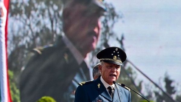 Mexican Defense Secretary Salvador Cienfuegos reads out a public apology before 26,000 soldiers assembled at a military base in Mexico City on April 16, 2016.