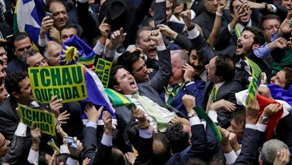 Right-wing members of the lower house of Congress celebrate after the vote to impeach President Dilma Rousseff wins, April 17, 2016.