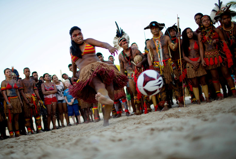 A native Brazilian kicks a soccer ball, during the Indigenous Youth Games of Pataxos nation in Santa Cruz de Cabralia, Bahia state, Brazil, April 17, 2016.