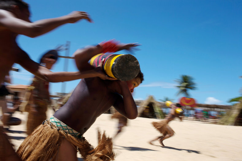 Native Brazilians compete in a tora competition, which is a race while carrying a log, during the Indigenous Youth Games of Pataxos nation in Santa Cruz de Cabralia, Bahia state, Brazil, April 18, 2016. 