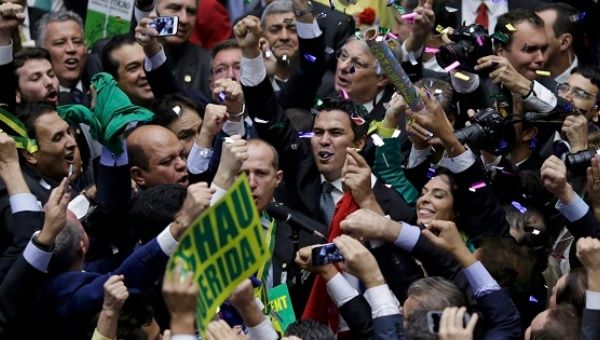 Members of the Lower House of Congress celebrate after they voted in favor of the impeachment of President Dilma Rousseff in Brasilia, Brazil April 17, 2016.