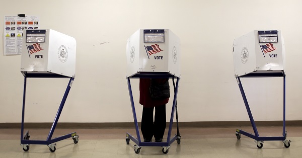 A voter is seen at a polling station during the New York primary elections in the Manhattan borough of New York.