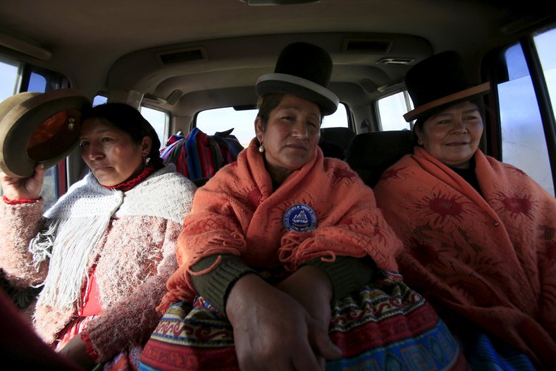 Aymara indigenous women Bertha Vedia (L), Dora Magueno (C) and Lidia Huayllas sit in a car in El Alto, Bolivia.