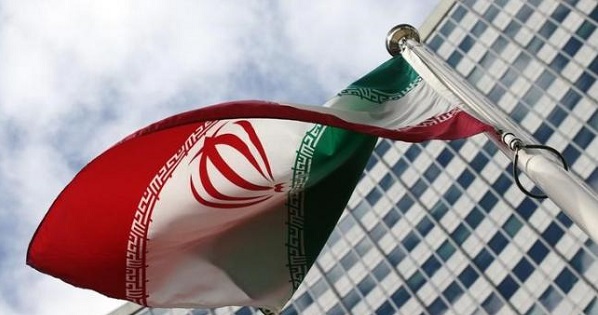 An Iranian flag flutters in front of the United Nations headquarters, during an International Atomic Energy Agency (IAEA) board of governors meeting, in Vienna, March 4, 2015.