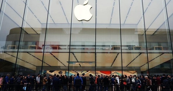 People line up outside an Apple store as iPhone SE goes on sale in China, in Hangzhou.