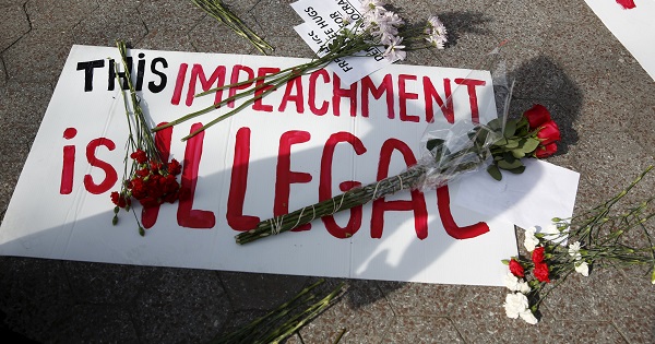 A protest sign during a rally against the impeachment during Dilma Rousseff's visit to New York to attend the United Nations COP21 signing, April 22, 2016.
