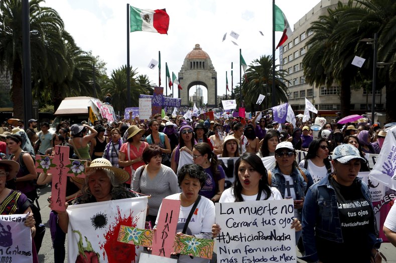Women in Mexico City march in memory of Mexican activist Nadia Herrera, murdered last year, and other victims of femicide and gender violence.