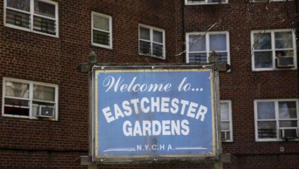 A sign for the Eastchester Gardens NYCHA housing complex stands in the Bronx, New York, April 27, 2016.
