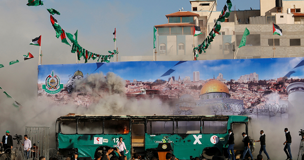 A mock burnt Israeli bus is seen on a stage during an anti-Israel rally organised by Palestinian Hamas movement in Gaza city April 28, 2016.