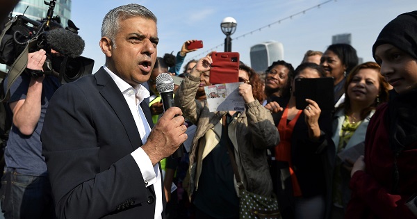 Britain's newly elected mayor Sadiq Khan speaks to supporters as he arrives for his first day at work at City Hall in London, Britain.