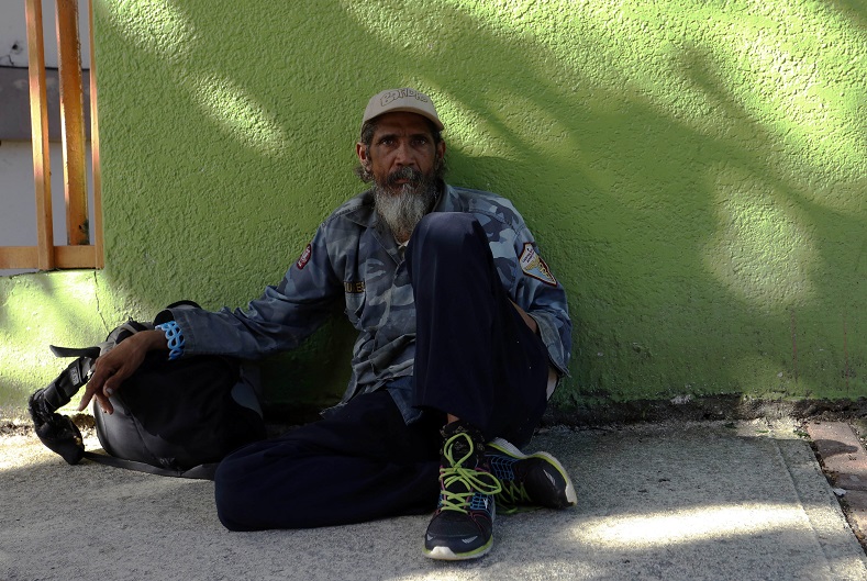 Felix Pizarro asks for money on the streets of Rio Piedras. Puerto Rico's financial crisis has led to a steep rise in unemployment and homelessness. 