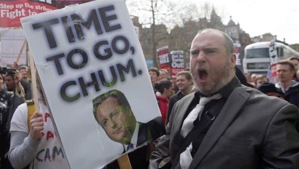 People chant slogans during a protest in London against Prime Minister David Cameron after documents from the Panama Papers leak revealed he uses tax havens.