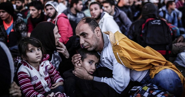 Refugees wait at Istanbul's Esenler station for buses to the Turkish-Greek border.
