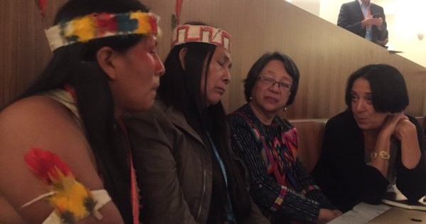 Indigenous leader Alicia Cayuiha sits with comrades at the UNPFII.