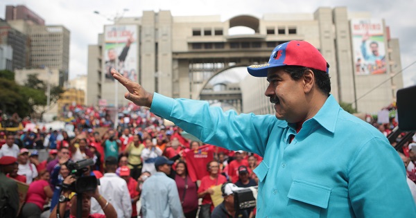 Venezuelan President Nicolas Maduro waves to a crowd that had assembled to show support for emergency measures announced by the government, Caracas, Venezuela, May 14, 2016.